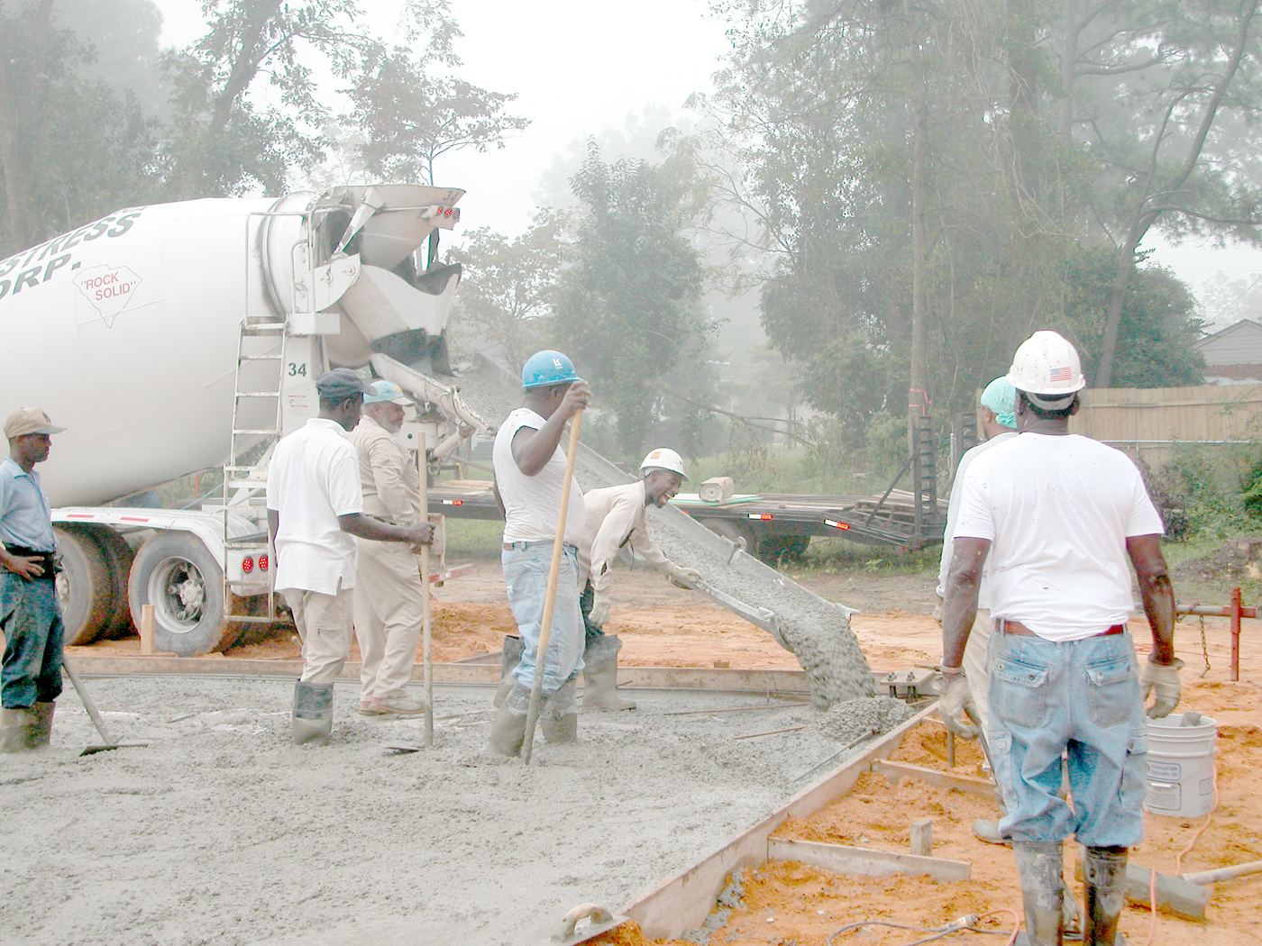 Concrete being placed from a mixer truck on site