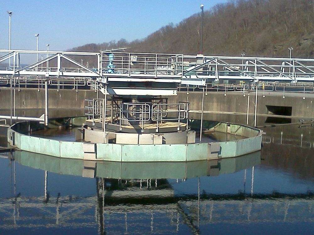 Circular clarifier tank at an industrial water treatment facility